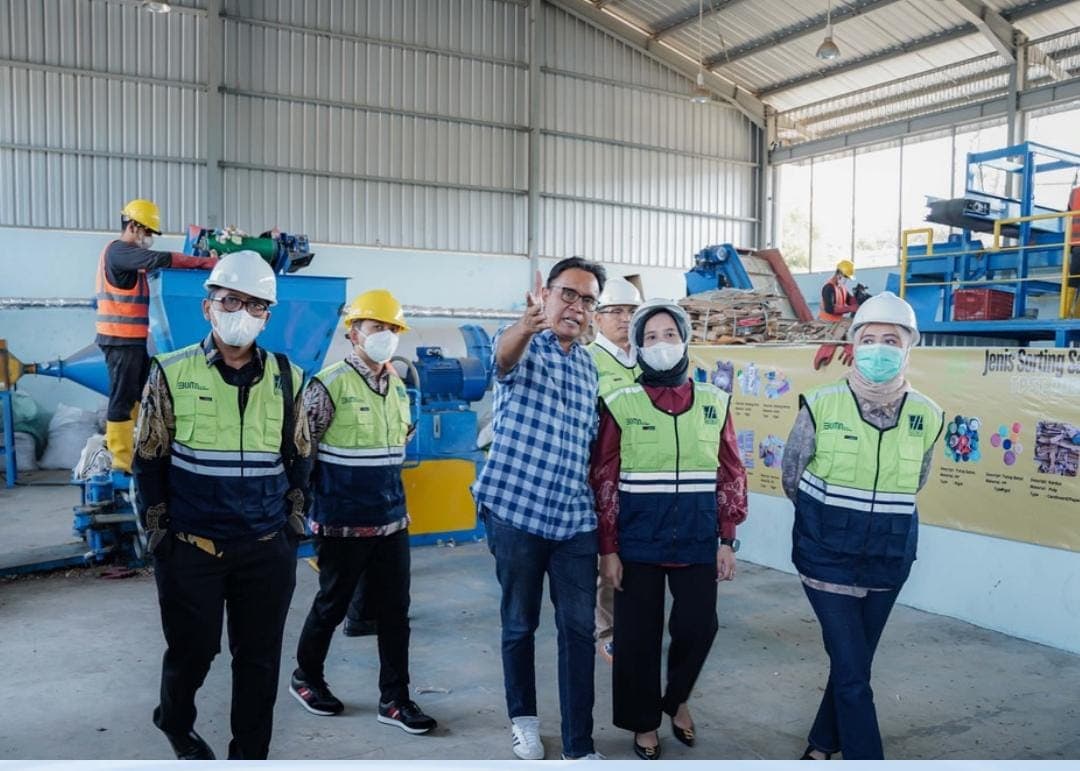 Leadership team touring Navasha waste processing facility